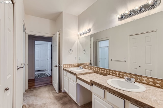 bathroom featuring vanity and hardwood / wood-style flooring