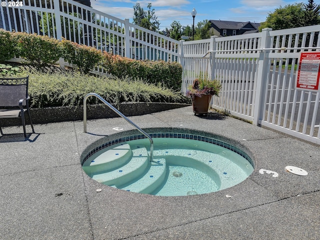 view of pool featuring a hot tub