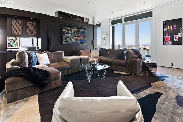 living room with a wealth of natural light and dark hardwood / wood-style flooring