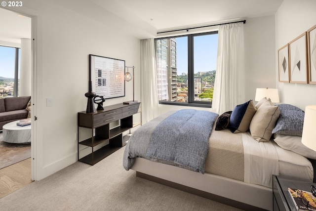 bedroom with light colored carpet