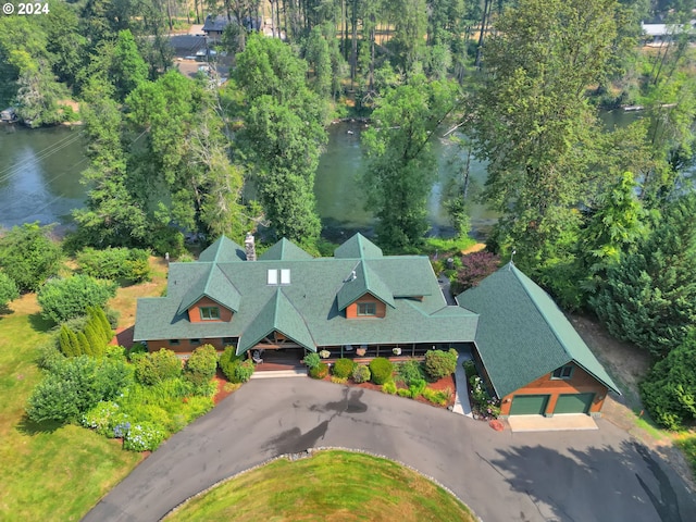 birds eye view of property with a water view