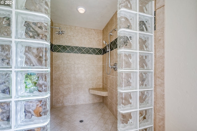 bathroom featuring a tile shower