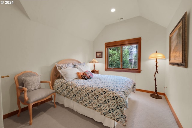 carpeted bedroom featuring vaulted ceiling