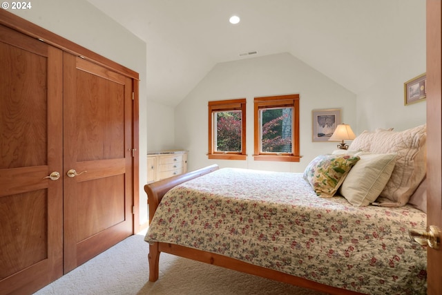 carpeted bedroom featuring vaulted ceiling