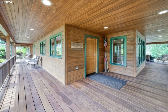 wooden terrace with a porch