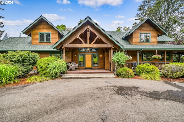 view of front of property featuring french doors and covered porch