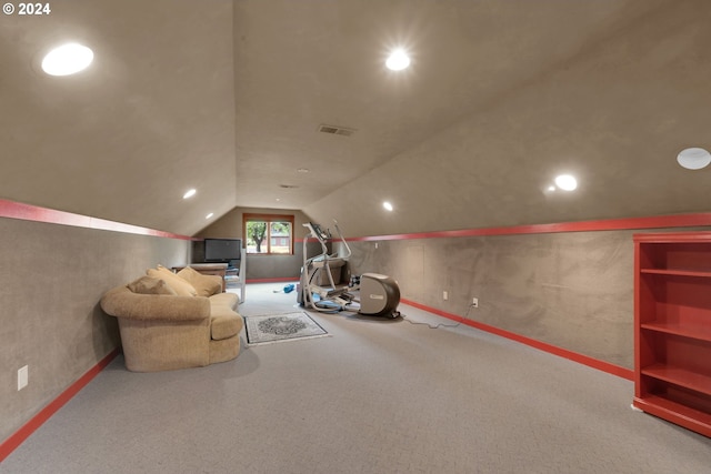 playroom featuring vaulted ceiling and carpet flooring