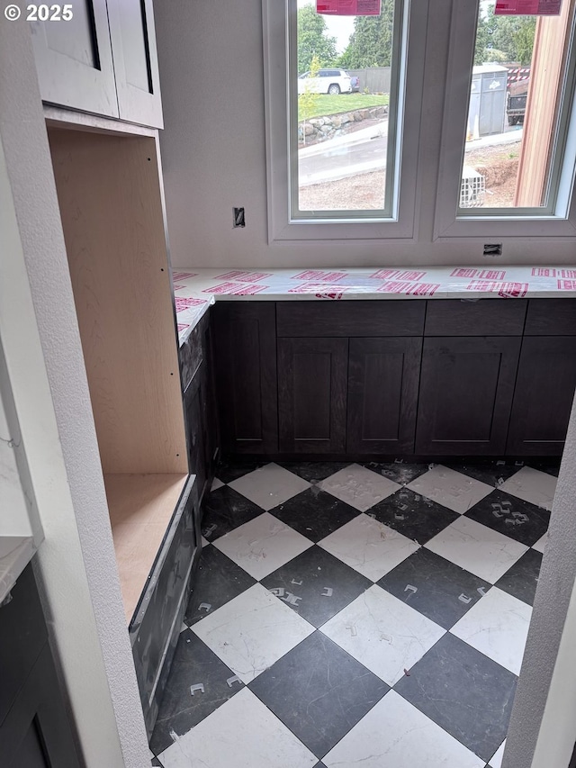 3734 Landis St, West Linn, OR 97068 - kitchen featuring plenty of natural light, light countertops, and dark cabinetry