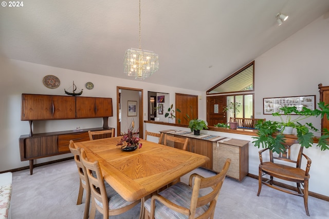 dining space featuring high vaulted ceiling, light colored carpet, and a chandelier