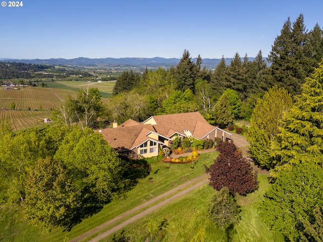 birds eye view of property with a rural view