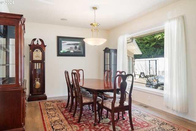 dining room with dark hardwood / wood-style flooring