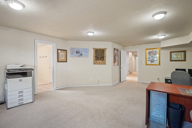 carpeted office with a textured ceiling