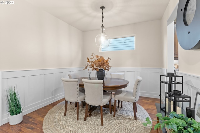 dining area with dark hardwood / wood-style flooring