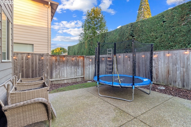 view of patio / terrace featuring a mountain view and a trampoline