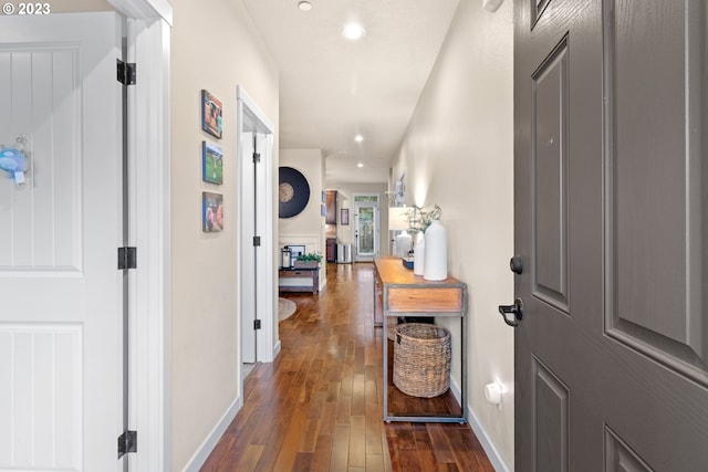 corridor featuring dark hardwood / wood-style flooring