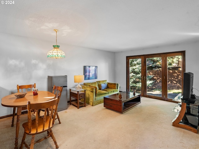 living room featuring light carpet