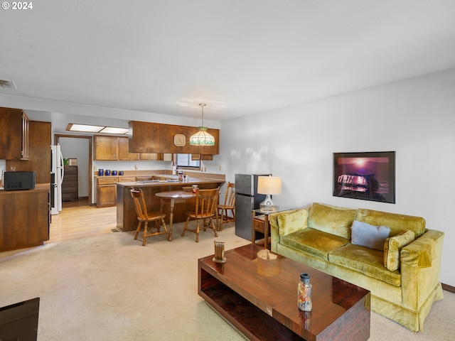 living room featuring light carpet