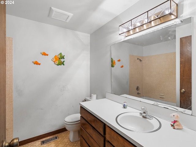 full bathroom featuring bathtub / shower combination, vanity, and toilet