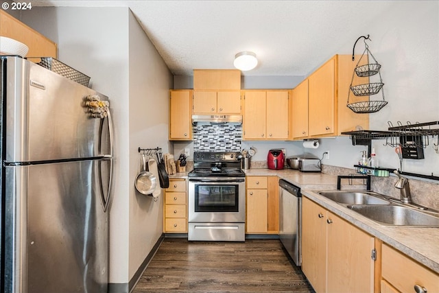 kitchen featuring tasteful backsplash, sink, appliances with stainless steel finishes, dark hardwood / wood-style flooring, and light brown cabinetry