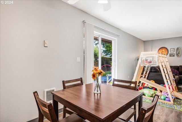 dining space featuring ceiling fan and hardwood / wood-style floors