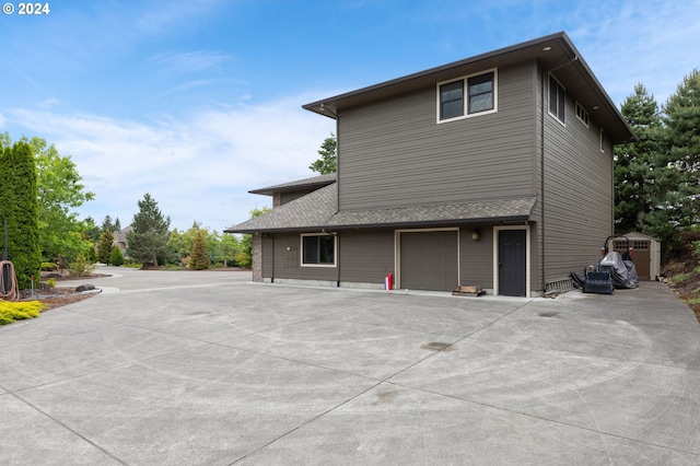 view of side of home with a garage