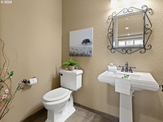 bathroom featuring tile patterned floors and toilet