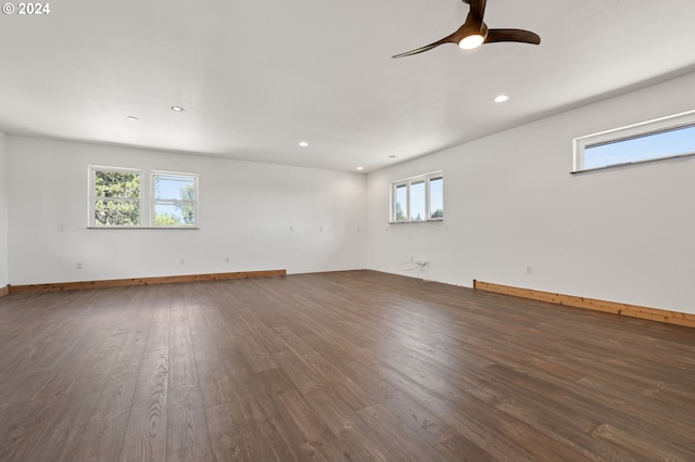 unfurnished room featuring ceiling fan and dark hardwood / wood-style flooring