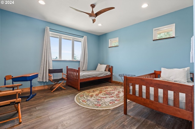 bedroom featuring hardwood / wood-style flooring and ceiling fan