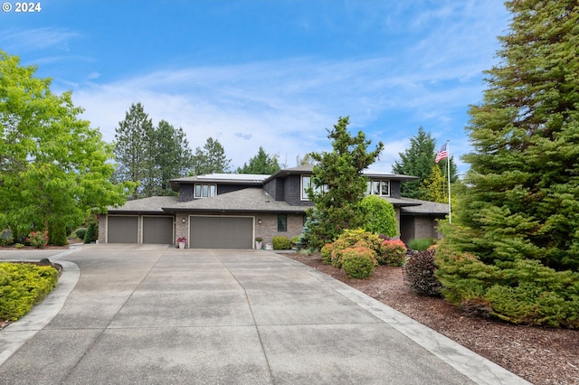 prairie-style home featuring a garage