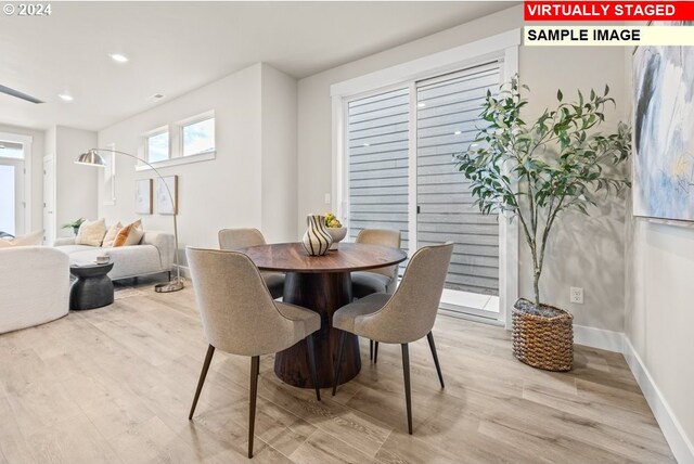 dining room with light hardwood / wood-style flooring