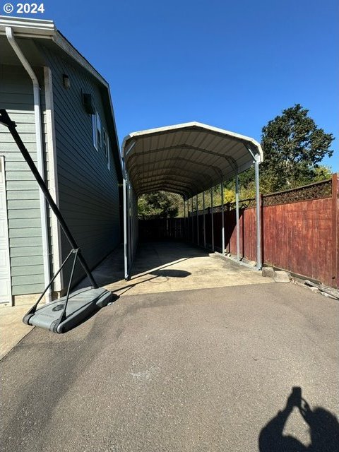 exterior space with a carport