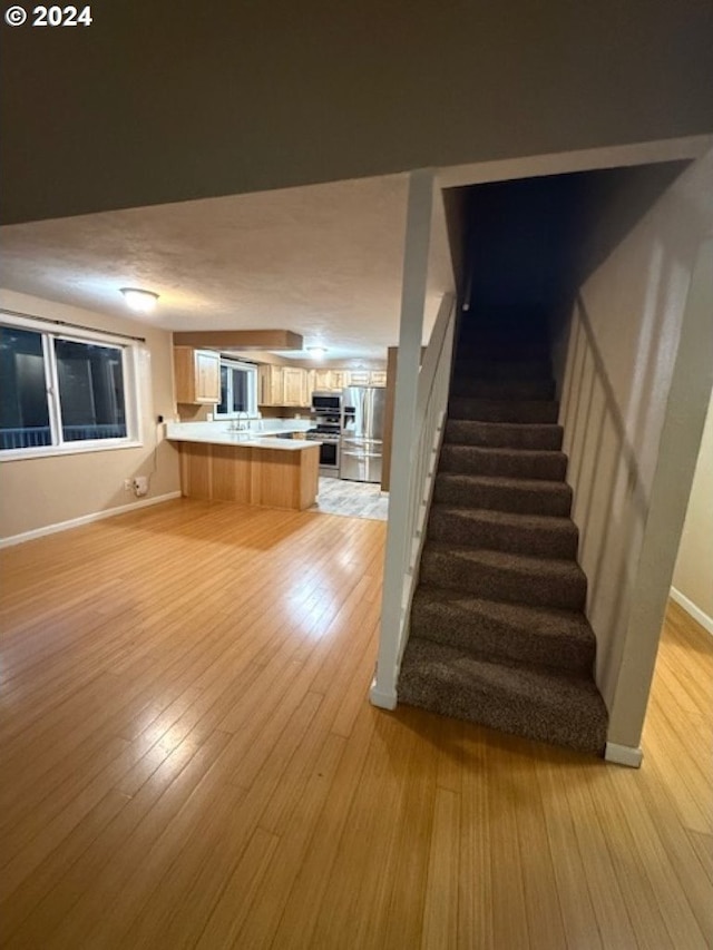 unfurnished living room featuring light hardwood / wood-style floors