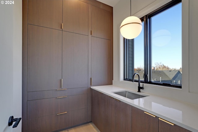 kitchen with hanging light fixtures and sink