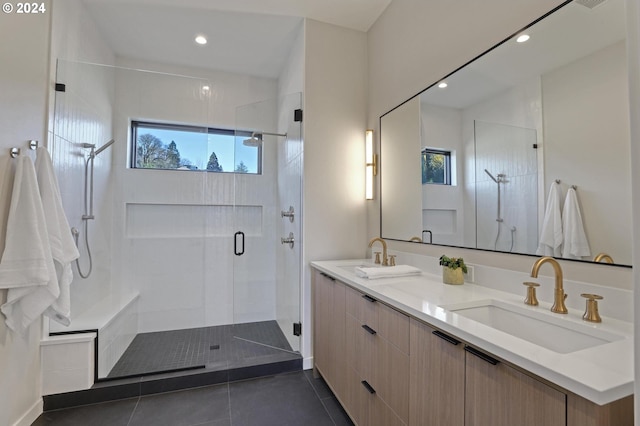 bathroom with tile patterned floors, vanity, and a shower with shower door