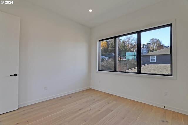 unfurnished room featuring light wood-type flooring