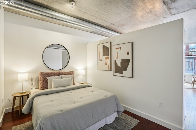 bedroom featuring dark wood-type flooring