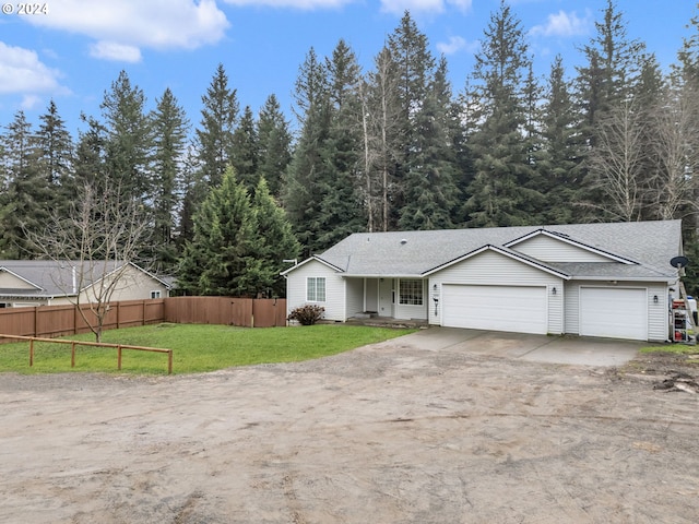 view of front facade featuring a front yard and a garage