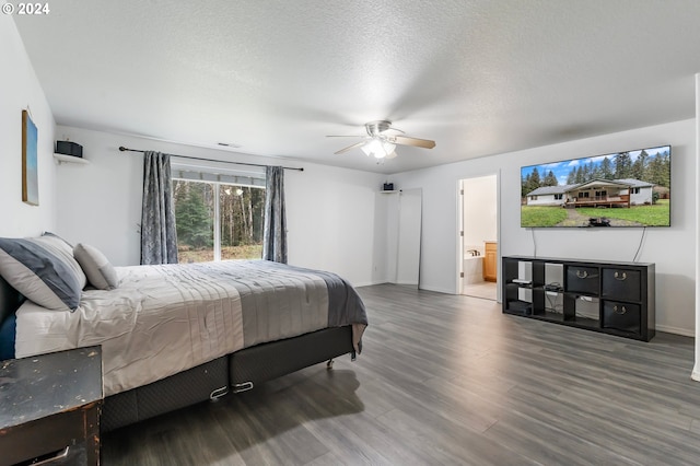 bedroom with wood-type flooring, connected bathroom, a textured ceiling, and ceiling fan