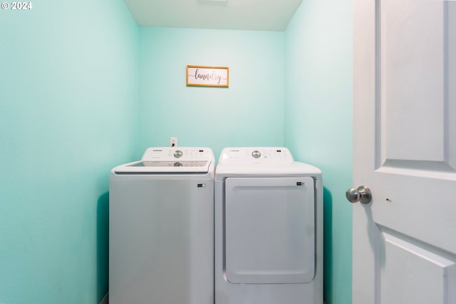 washroom featuring washer and clothes dryer