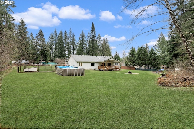 view of yard with a pool side deck