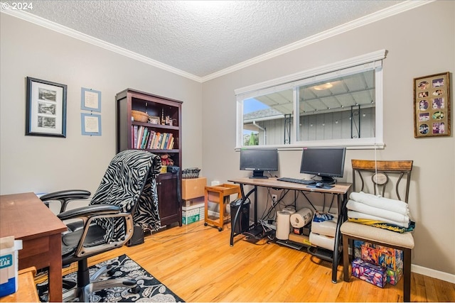 office with a textured ceiling, ornamental molding, and hardwood / wood-style flooring