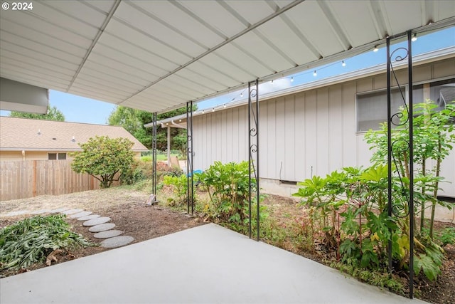 view of patio / terrace featuring fence