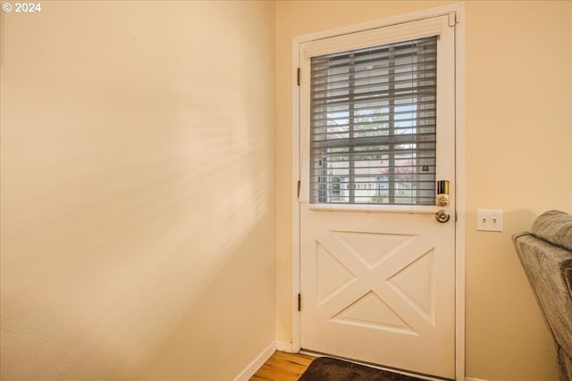 entryway with light wood finished floors