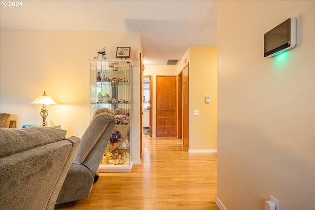 hallway with wood-type flooring