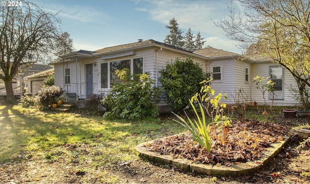 view of home's exterior featuring a lawn and a garage