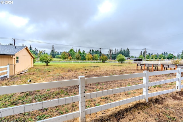 view of yard with a rural view