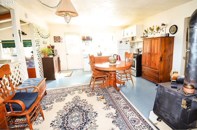 dining area with concrete flooring