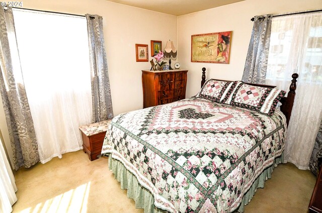 bedroom with light colored carpet