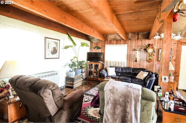 living room with wood ceiling, beamed ceiling, and wooden walls