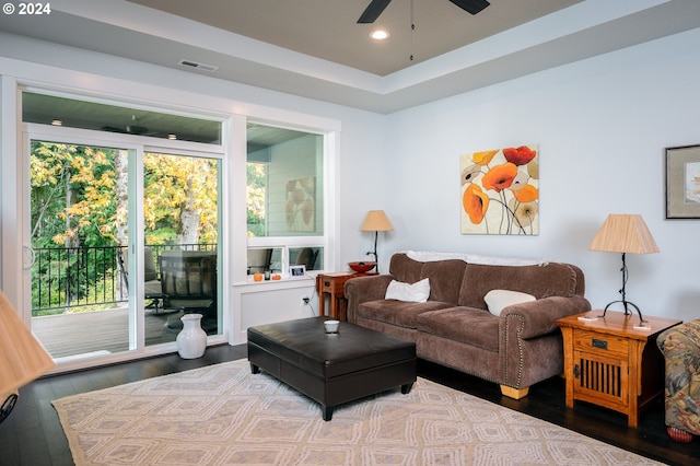 living room featuring ceiling fan and wood-type flooring